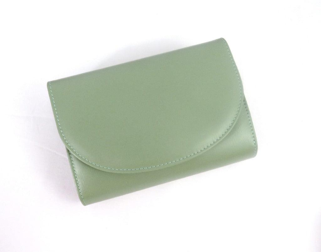 Green Addison clutch on a white background