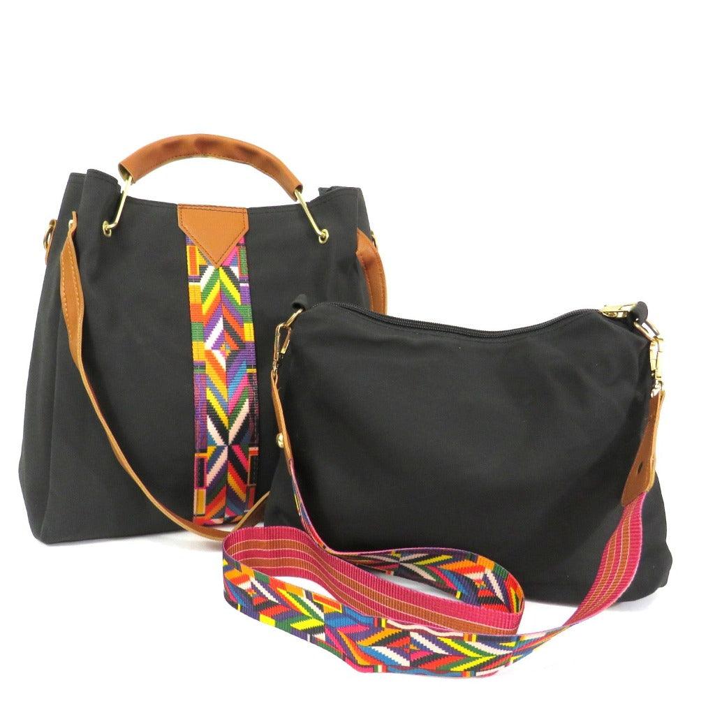 the chole 2 piece carry all a beautiful large black purse with camel handles and multi color stripe detail and comes with a smaller black purse you can use as a makeup bag or crossbody with the strap